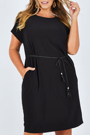 Model Fiona wearing size 16 of The Belted Midi Dress in colour Black (Black), from the front, cropped image