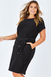 Model Fiona wearing size 16 of The Belted Midi Dress in colour Black (Black), from the front, cropped image