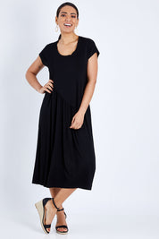 Model Pamela wearing size 10 of The Essential Tee Dress in colour Black (Black), from the front, showing the whole outfit