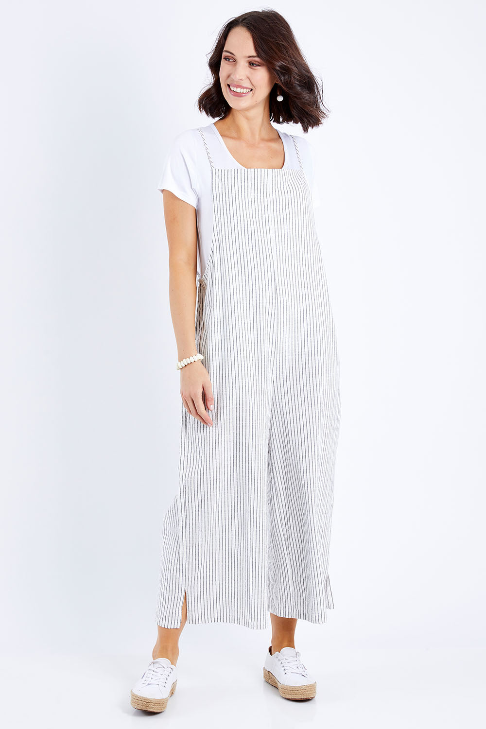 Model Andrea wearing size 10 of The Easy Day Jumpsuit in colour Whtstripe (White), from the front, showing the whole outfit