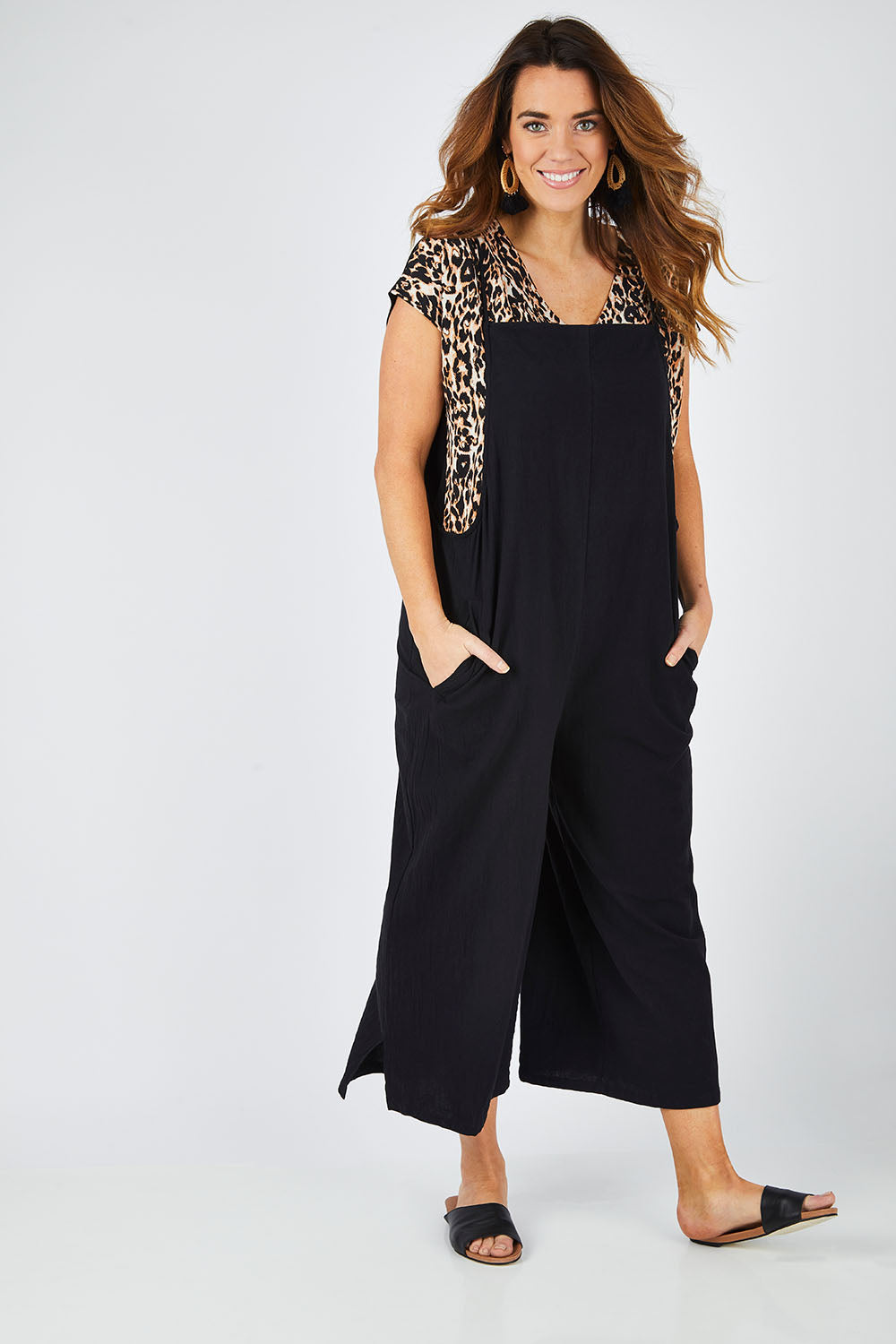Model Laura wearing size 14 of The Easy Day Jumpsuit in colour Black (Black), from the front, showing the whole outfit