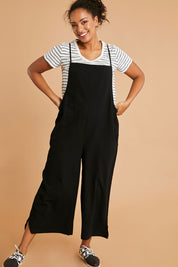 Model Noli wearing size 14 of The Easy Day Jumpsuit in colour Black (Black), from the front, showing the whole outfit