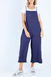 Model Chelsea wearing size 10 of The Easy Day Jumpsuit in colour Navy (Blue), from the front, cropped image
