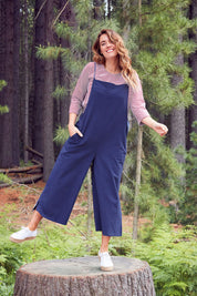 Model Laura wearing size 14 of The Easy Day Jumpsuit in colour Navy (Blue), from the front, showing the whole outfit