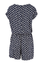 Product shot of The Printed Tie Waist Playsuit in colour Multiprint (Black), from the back