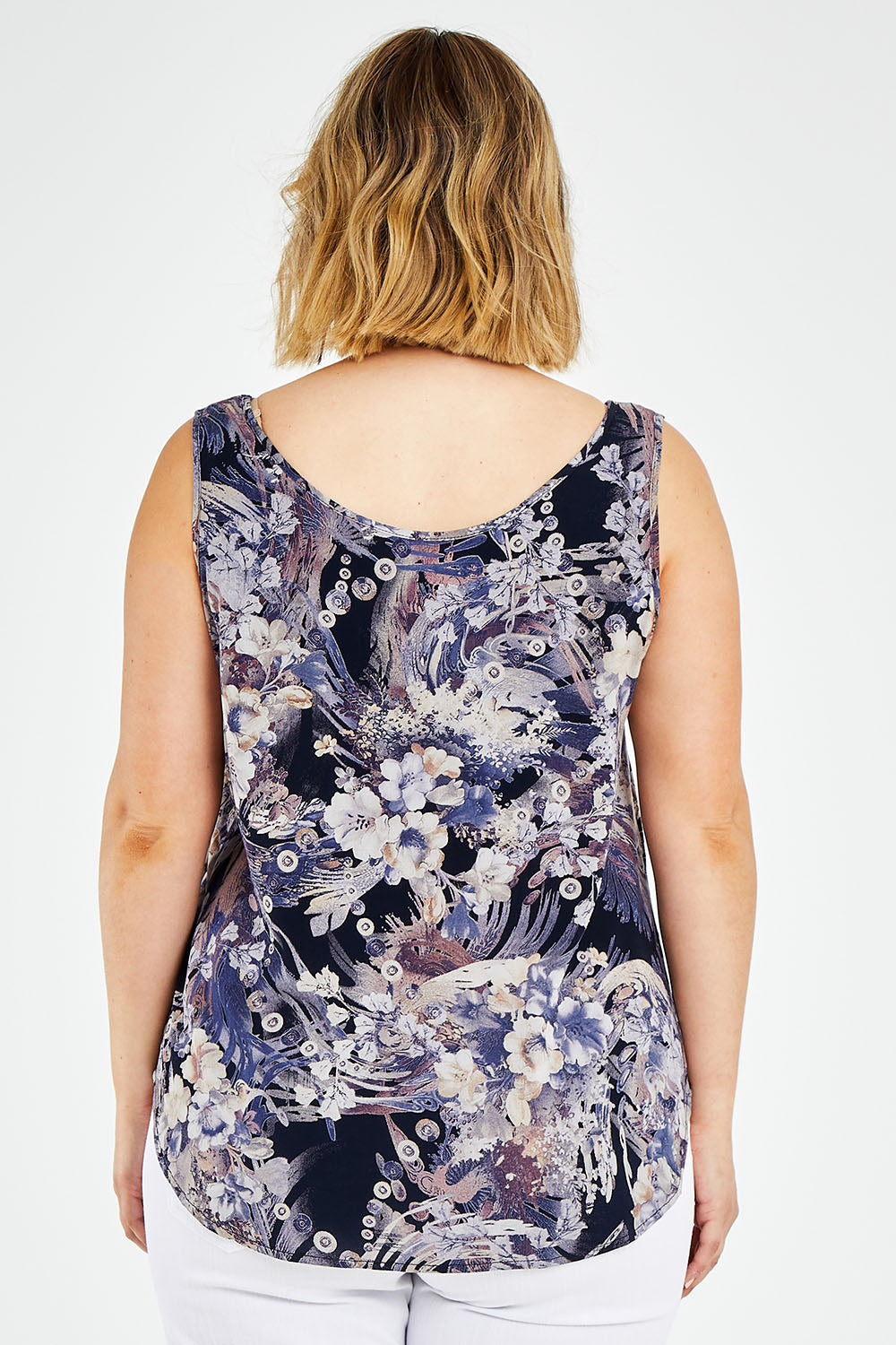 Model Jess wearing size 14 of The Reversible Tank in colour Multiprint (Blue), from the back