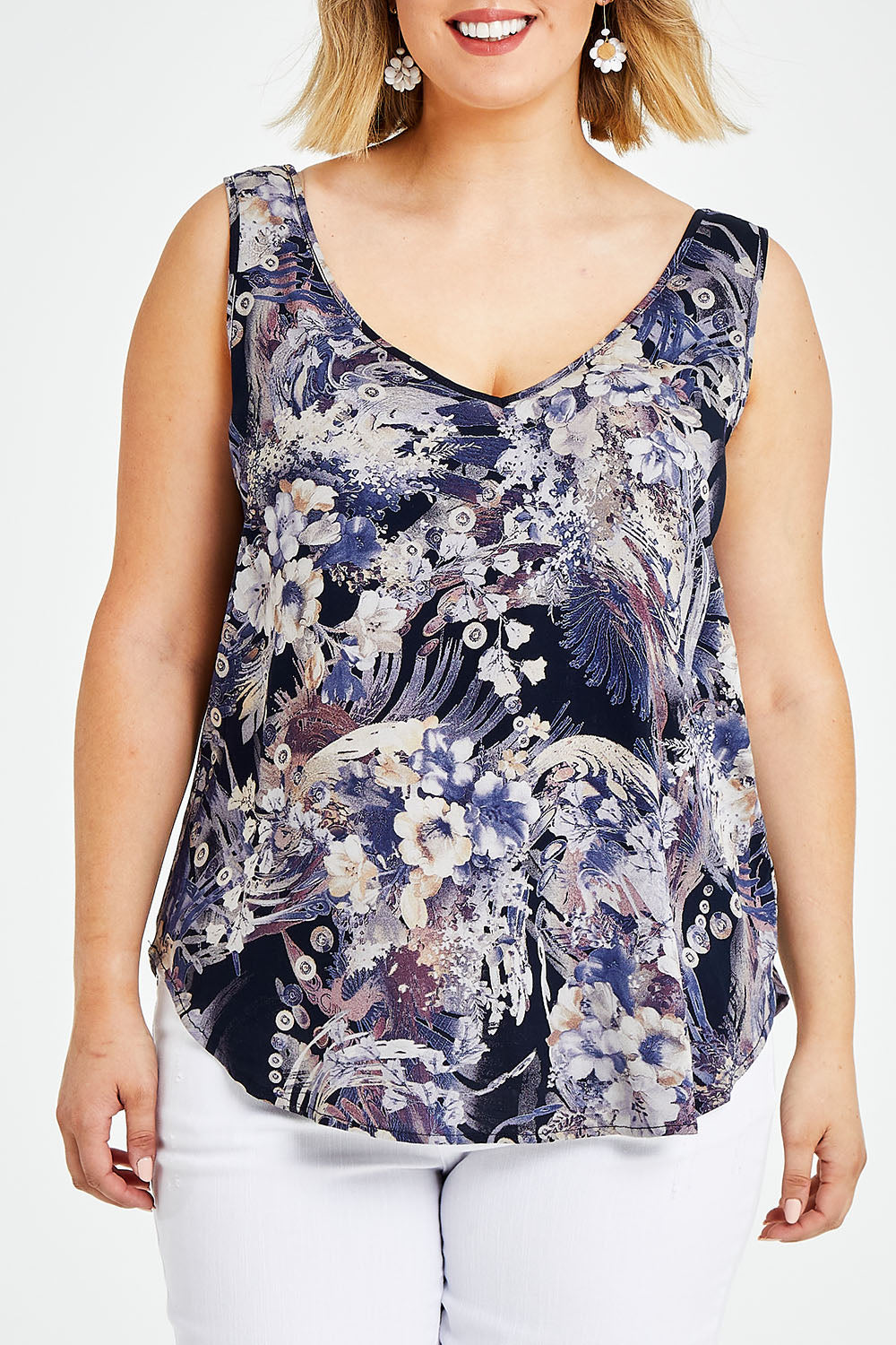 Model Jess wearing size 14 of The Reversible Tank in colour Multiprint (Blue), from the front, cropped image