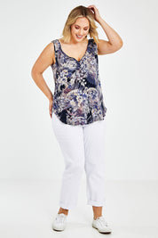 Model Jess wearing size 14 of The Reversible Tank in colour Multiprint (Blue), from the front, showing the whole outfit
