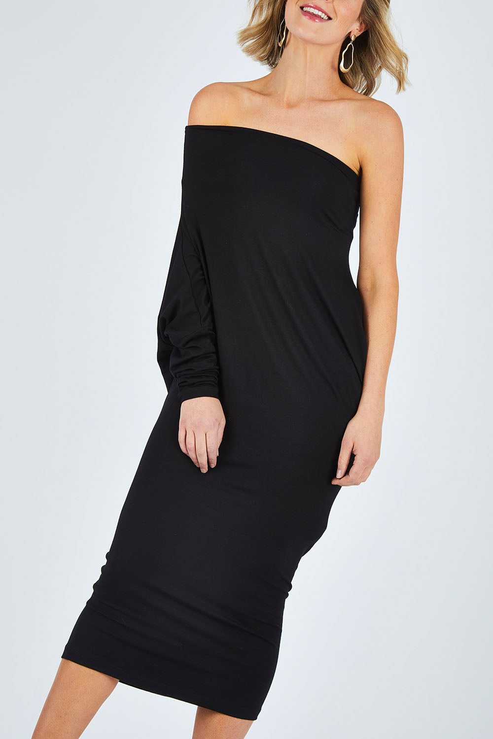 Model Chelsea wearing size 10 of The Multiin colourWay Dress - Black (Black), from the front, cropped image