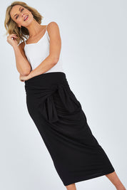 Model Chelsea wearing size 10 of The Multiin colourWay Dress - Black (Black), from the front, cropped image