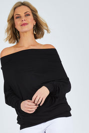 Model Chelsea wearing size 10 of The Multiin colourWay Dress - Black (Black), from the front, cropped image