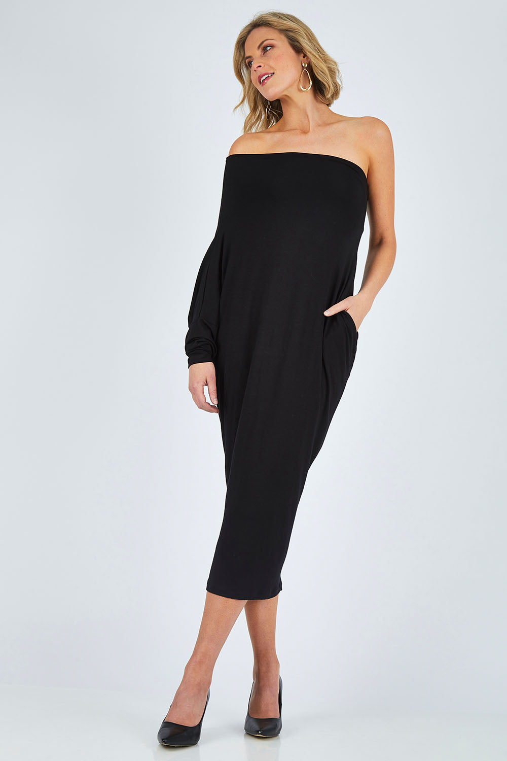 Model Chelsea wearing size 10 of The Multiin colourWay Dress - Black (Black), from the front, showing the whole outfit