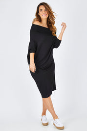 Model Laura wearing size 14 of The Multiin colourWay Dress - Black (Black), from the front, showing the whole outfit