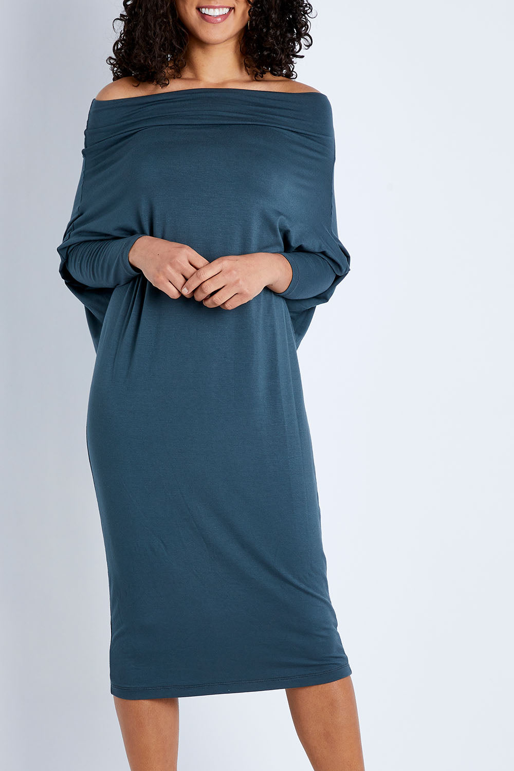 Model Pamela wearing size 10 of The Multiin colourWay Dress - Forest (Green), from the front, cropped image