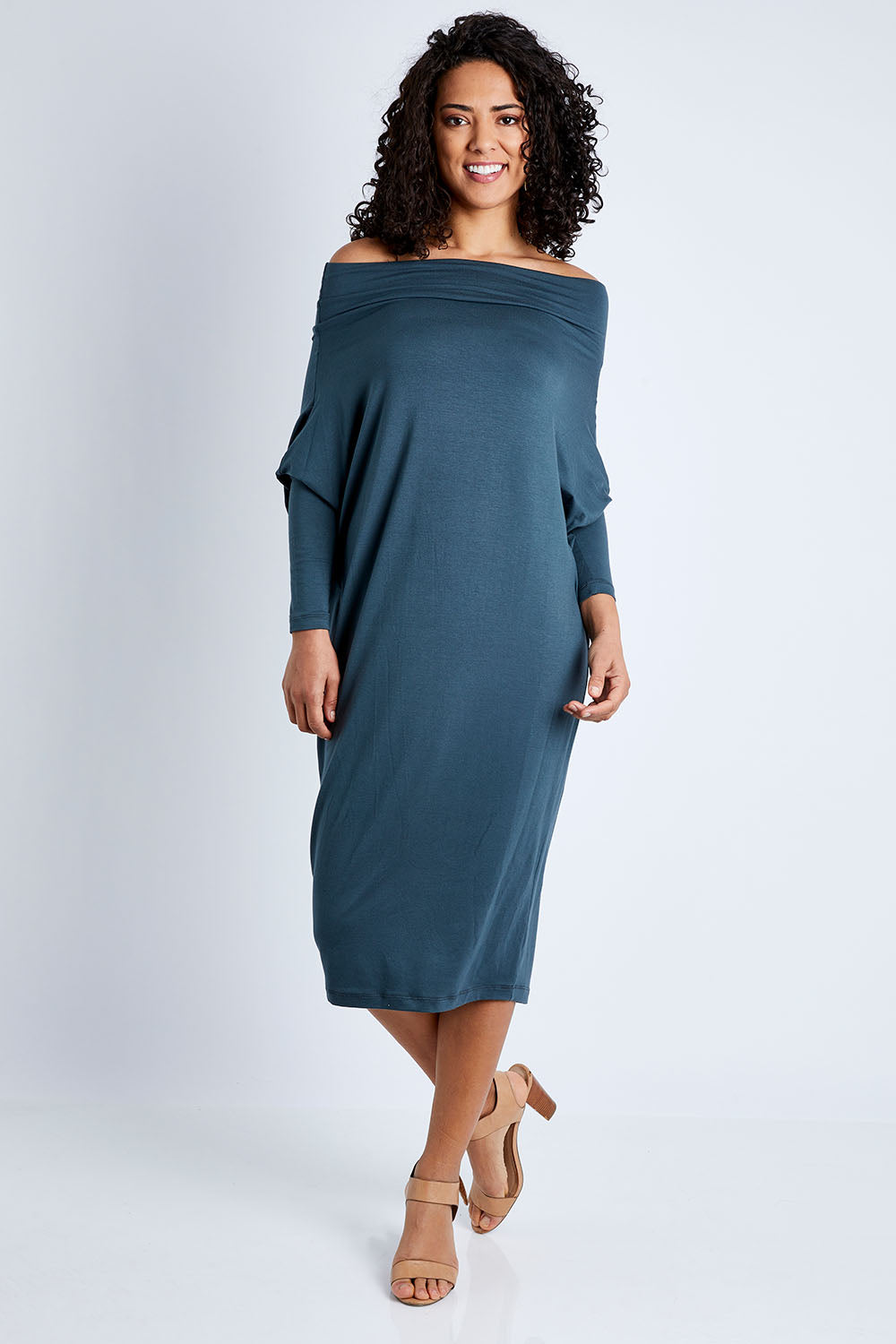 Model Pamela wearing size 10 of The Multiin colourWay Dress - Forest (Green), from the front, showing the whole outfit