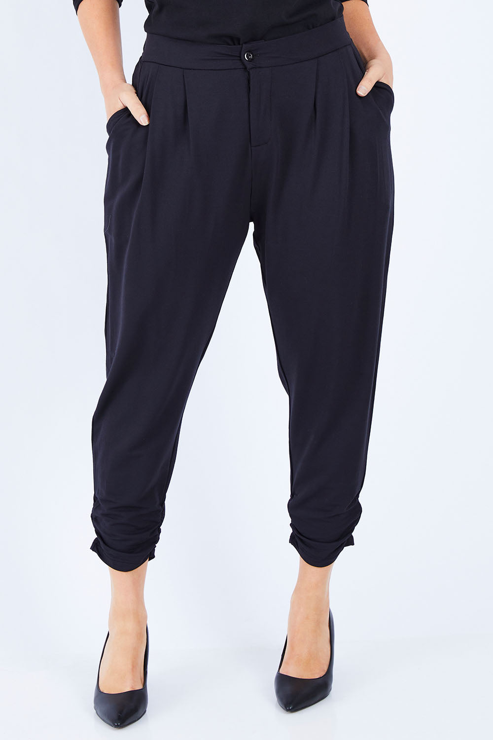 Model Laura wearing size 14 of The Winter Best Seller Pant in colour Black (Black), from the front, cropped image