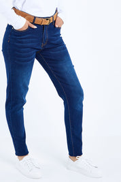 Model Kimberley wearing size 10 of The Mid Rise Skinny Jean in colour Denim (Blue), from the front, cropped image