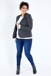 Model Sasha-Lee wearing size 16 of The Mid Rise Skinny Jean in colour Denim (Blue), from the front, showing the whole outfit