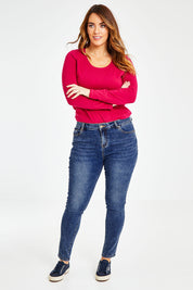 Model Laura wearing size 14 of The Mid Rise Skinny Jean in colour Washdenim (Blue), from the front, showing the whole outfit