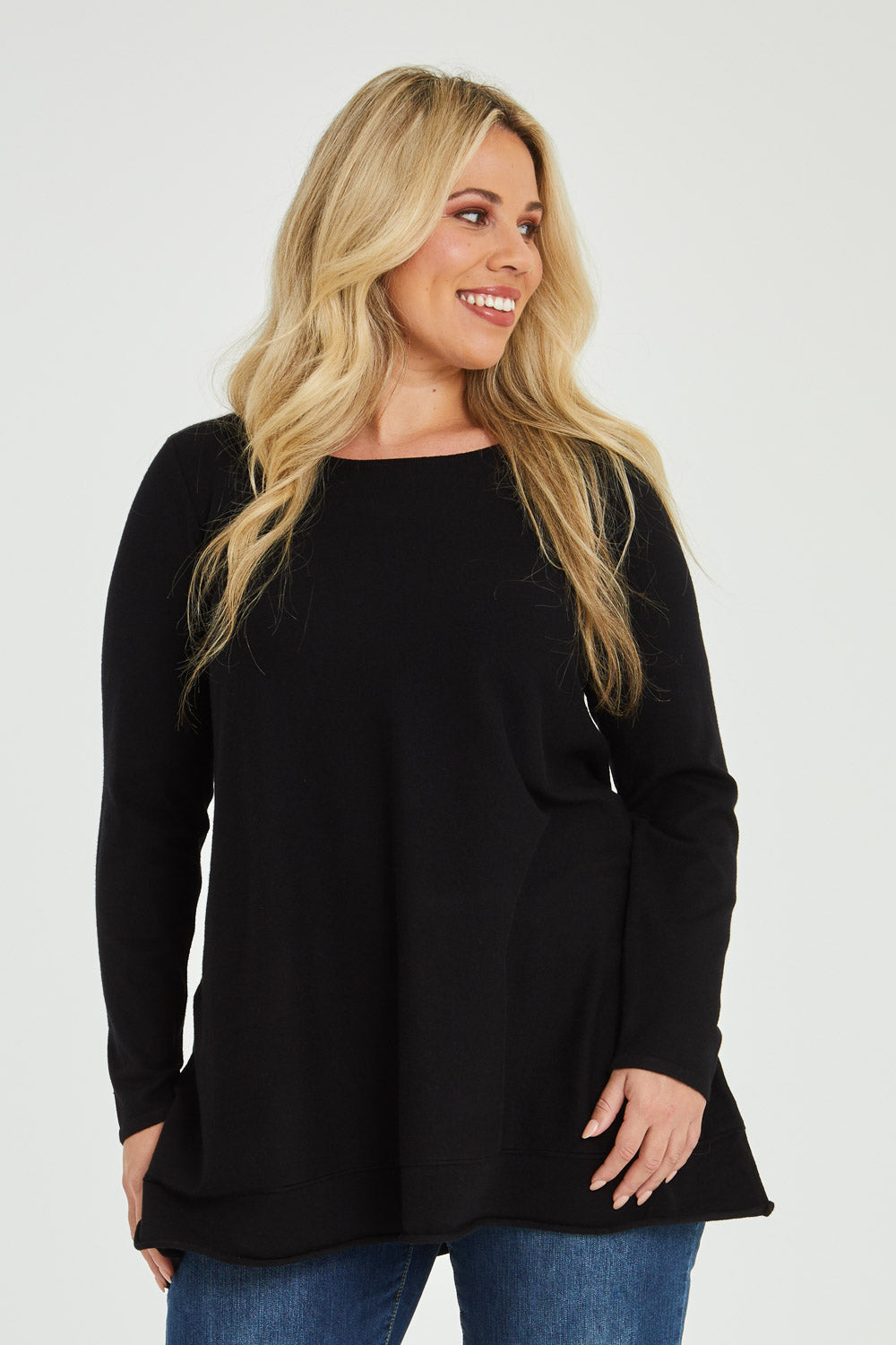 Model Katie wearing size XL of The Swing Knit in colour Black (Black), from the front, cropped image