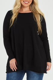 Model Katie wearing size XL of The Swing Knit in colour Black (Black), from the front, cropped image