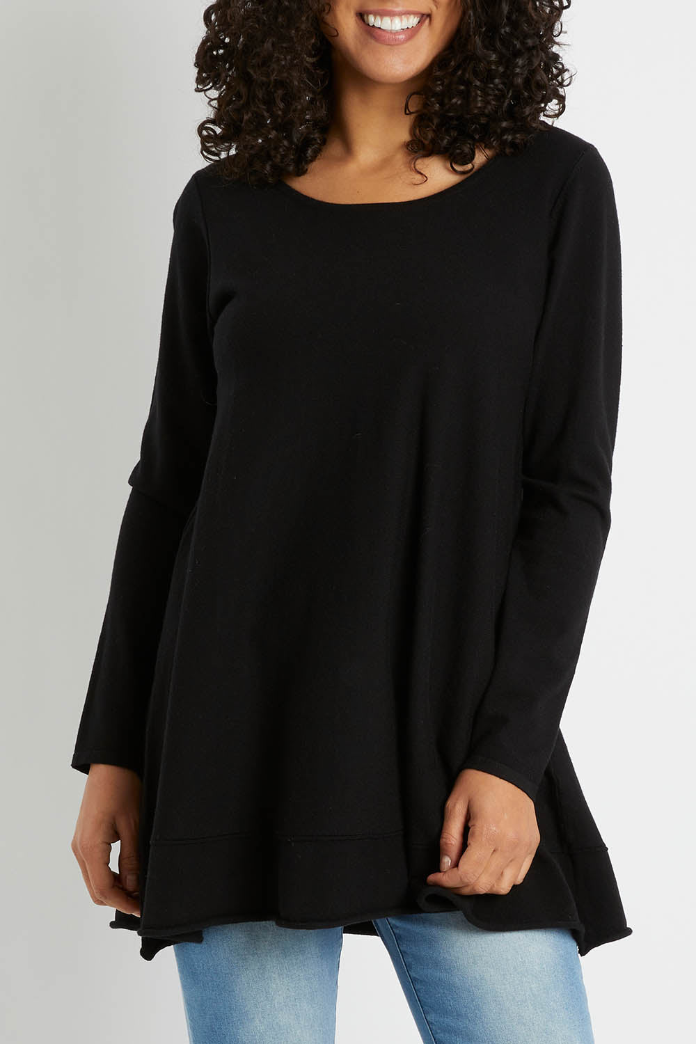 Model Pamela wearing size S of The Swing Knit in colour Black (Black), from the front, cropped image