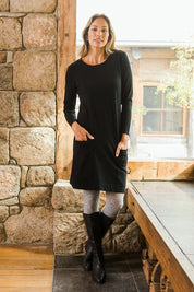 Model Amanda wearing size S of The Pocket Detail Dress in colour Black (Black), from the front, showing the whole outfit
