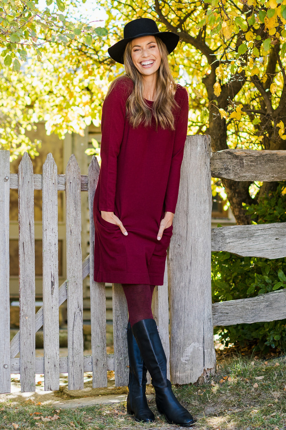 Model Amanda wearing size S of The Pocket Detail Dress in colour Burgundy (Red), from the front, showing the whole outfit