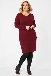 Model Jess wearing size L of The Pocket Detail Dress in colour Burgundy (Red), from the front, showing the whole outfit