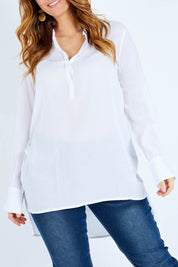 Model Laura wearing size 14 of The Longline Button Shirt in colour White (White), from the front, cropped image