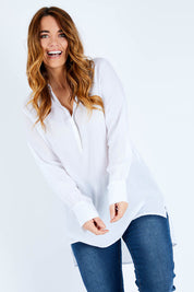 Model Laura wearing size 14 of The Longline Button Shirt in colour White (White), from the front, cropped image