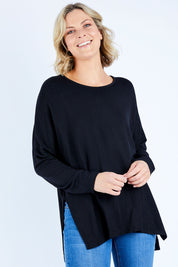 Model Chelsea wearing size S of The Side Split Tunic Top in colour Black (Black), from the front, cropped image