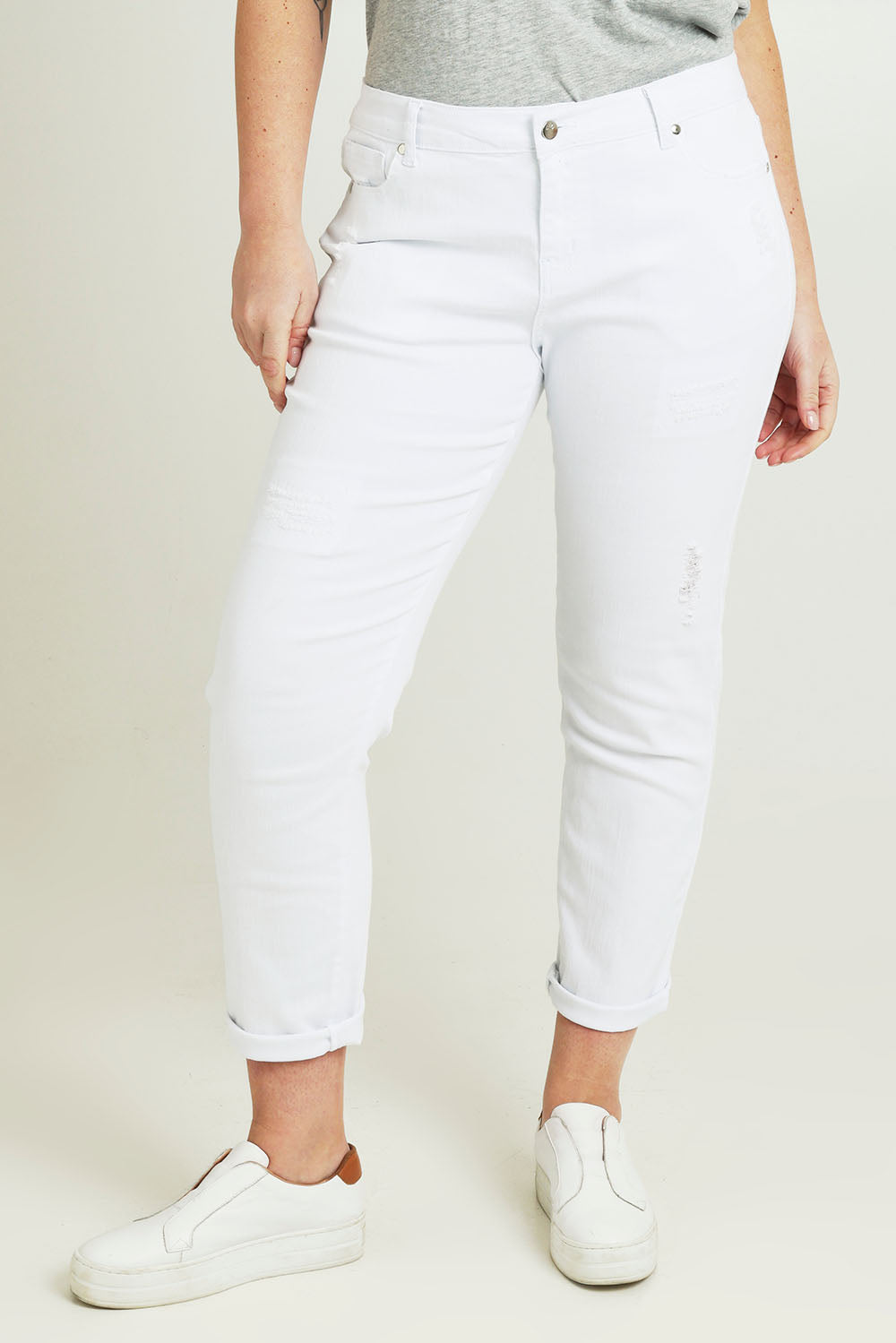 Model Jane wearing size 14 of The Distressed Boyfriend Slim Leg Jean in colour White (White), from the front, cropped image