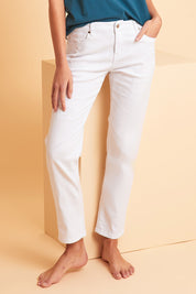 Model Madeline wearing size 10 of The Distressed Boyfriend Slim Leg Jean in colour White (White), from the front, showing the whole outfit