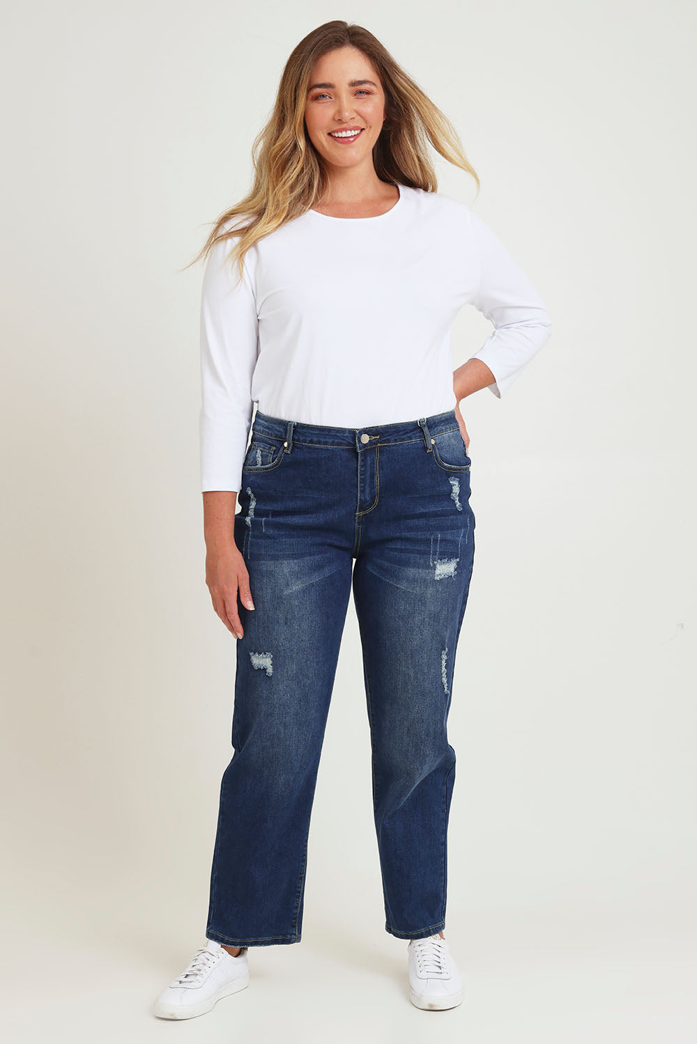 Model Chanel wearing size 16 of The Distressed Boyfriend Jean in colour Mediumblue (Blue), from the front, showing the whole outfit