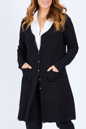Model Laura wearing size 14 of The Rib Longline Cardi in colour Black (Black), from the front, cropped image