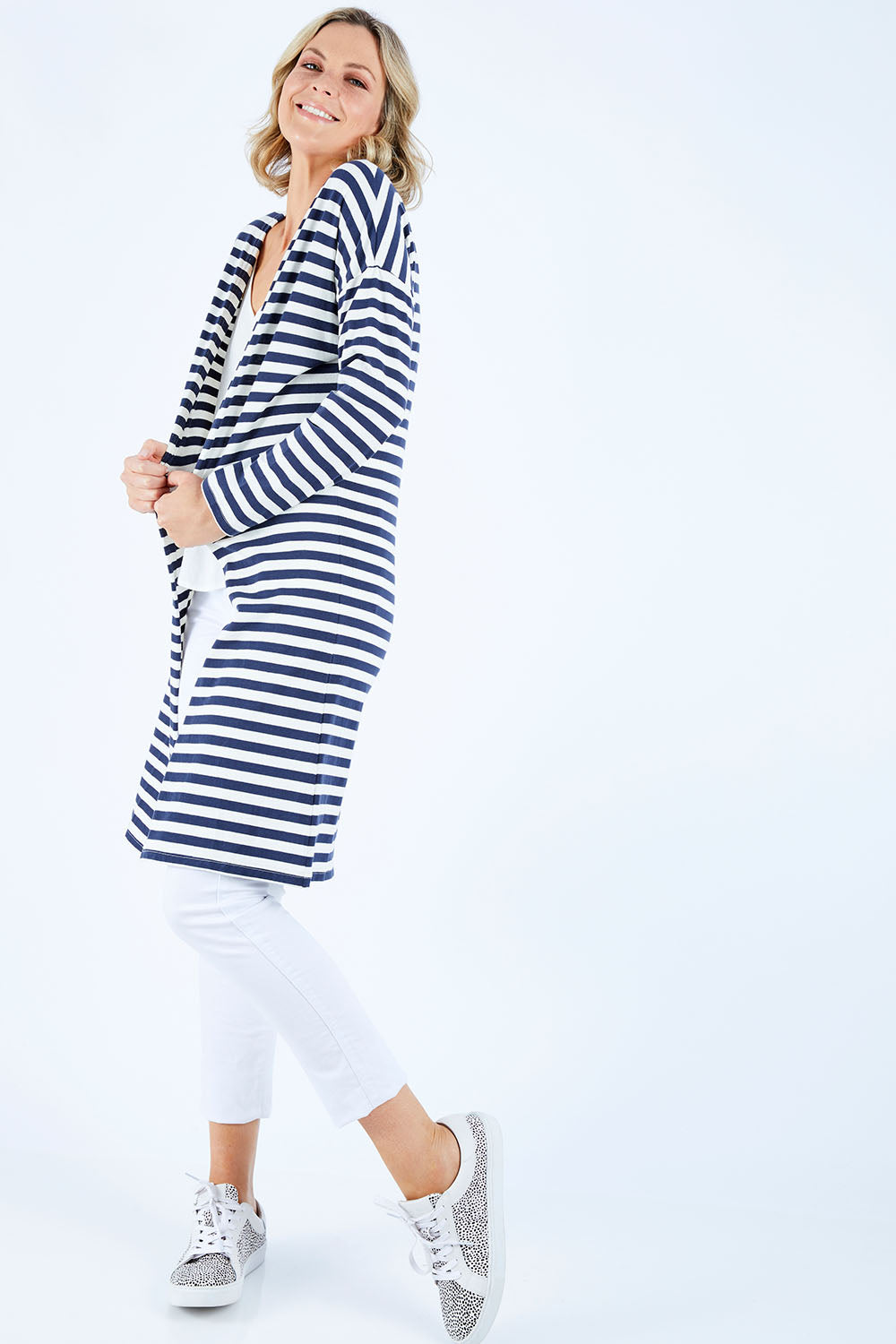 Model Chelsea wearing size 10 of The Relaxed Cotton Cardi in colour Navystripe (Blue), from the front, showing the whole outfit