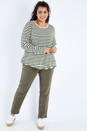 Model Sasha-Lee wearing size 16 of The Relaxed Cotton Long Sleeve Tee in colour Khaki (Green), from the front, showing the whole outfit