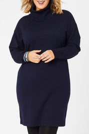 Model Jess wearing size L of The Roll Neck Tunic Dress in colour Navy (Blue), from the front, cropped image