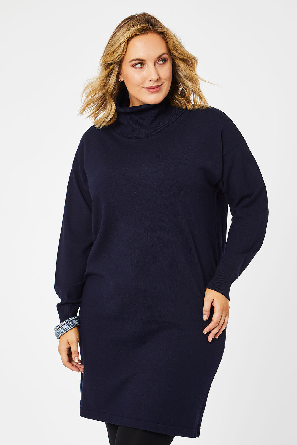 Model Jess wearing size L of The Roll Neck Tunic Dress in colour Navy (Blue), from the front, cropped image