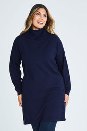 Model Palatina wearing size XL of The Roll Neck Tunic Dress in colour Navy (Blue), from the front, cropped image