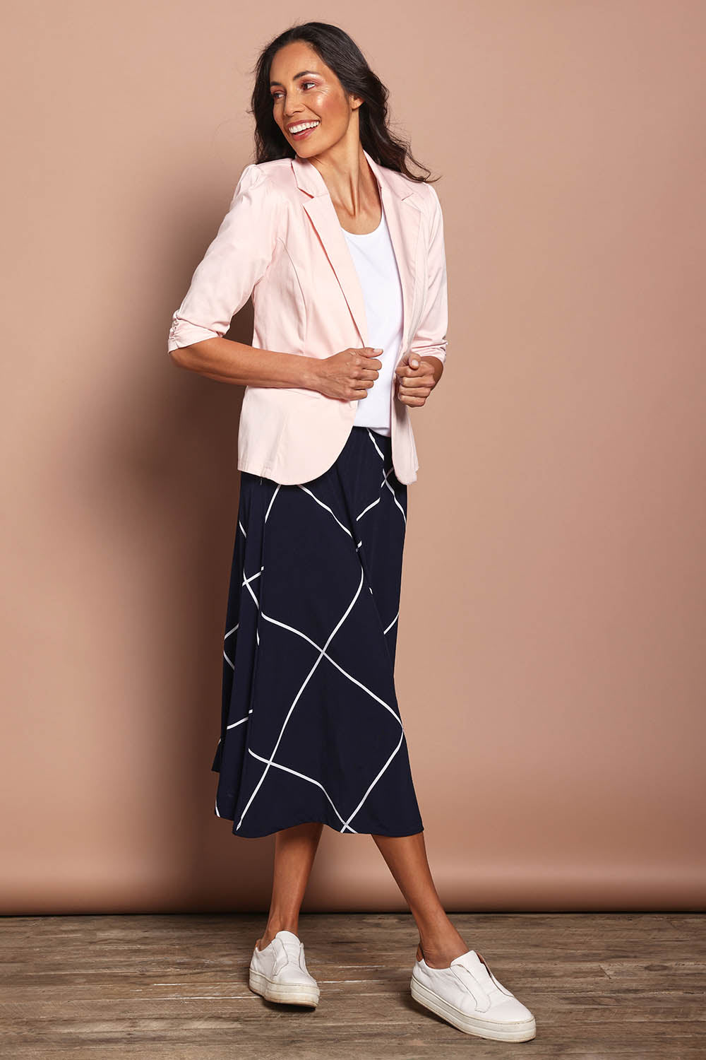 Model Amanda wearing size 10 of The Everyday Blazer in colour Blush (Pink), from the front, showing the whole outfit