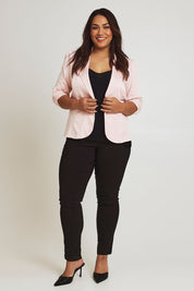 Model Ashleigh wearing size 16 of The Everyday Blazer in colour Blush (Pink), from the front, showing the whole outfit