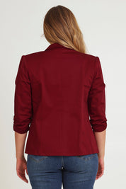 Model Chanel wearing size 16 of The Everyday Blazer in colour Chillired (Red), from the back