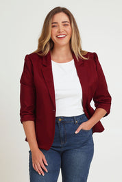 Model Chanel wearing size 16 of The Everyday Blazer in colour Chillired (Red), from the front, cropped image