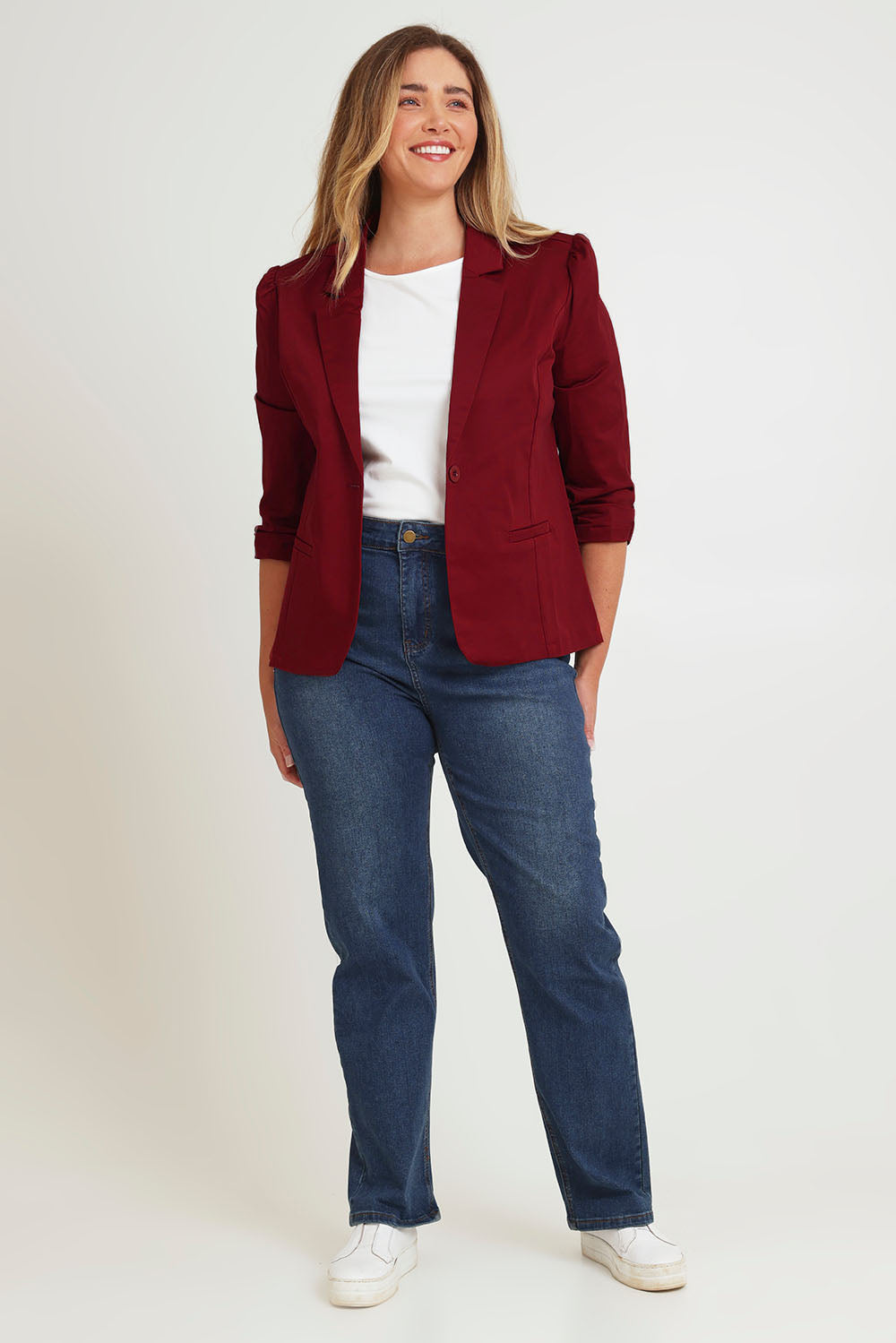 Model Chanel wearing size 16 of The Everyday Blazer in colour Chillired (Red), from the front, showing the whole outfit