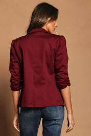 Model Madeline wearing size 10 of The Everyday Blazer in colour Chillired (Red), from the back