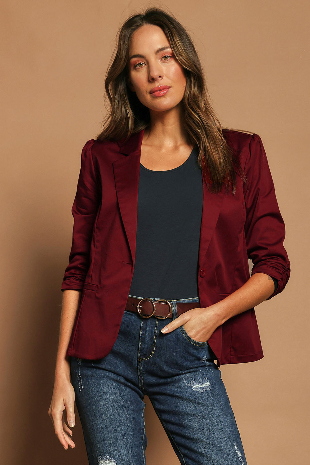 Model Madeline wearing size 10 of The Everyday Blazer in colour Chillired (Red), from the front, cropped image
