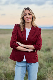 Model Tegan wearing size 10 of The Everyday Blazer in colour Chillired (Red), from the front, showing the whole outfit