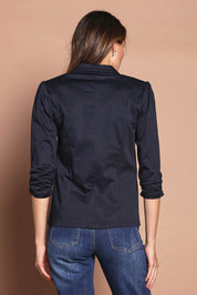 Model Madeline wearing size 10 of The Everyday Blazer in colour DarkNavy (Blue), from the back